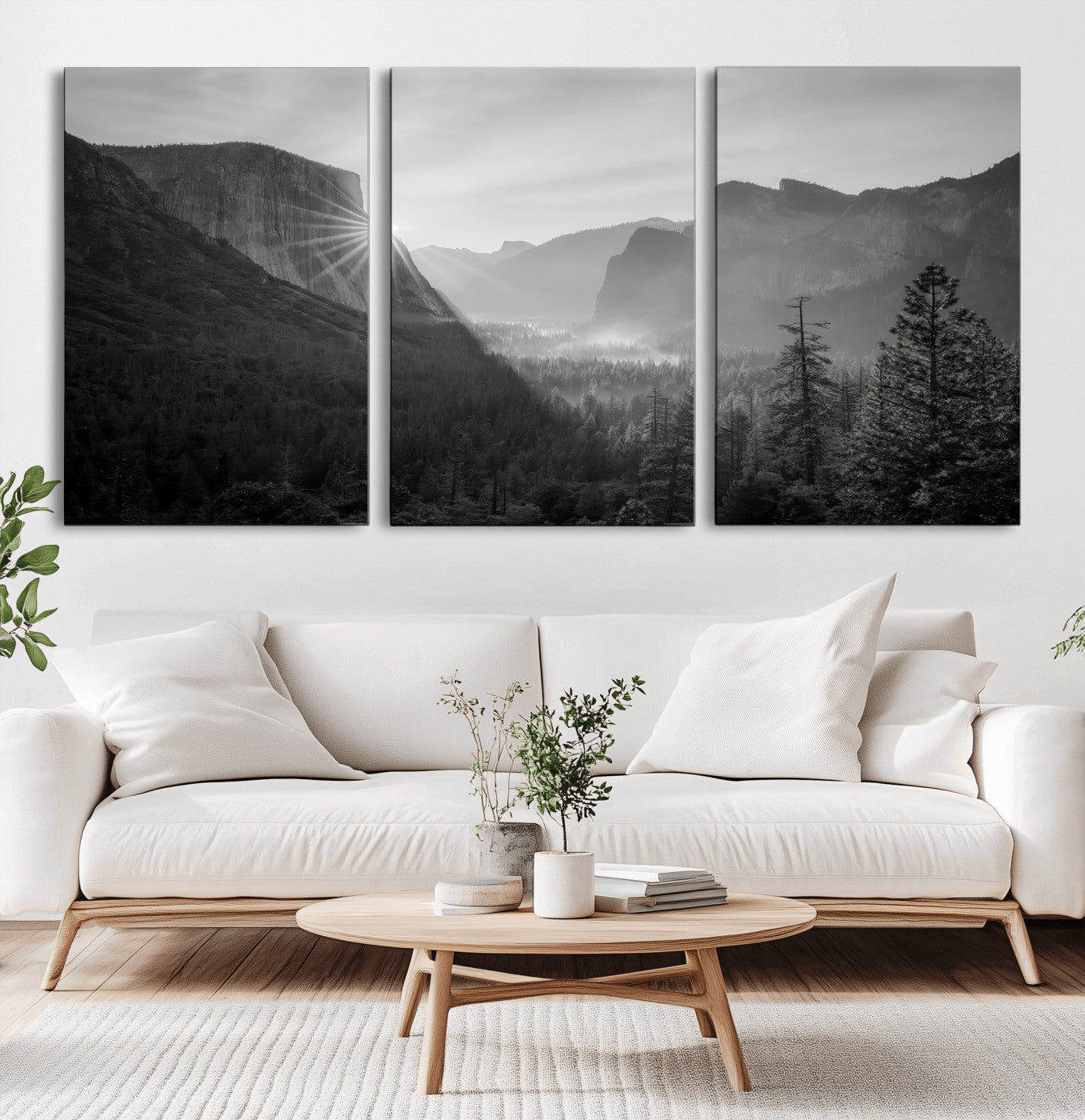 Black and white landscape of Yosemite with sun rays peeking over El Capitan, ideal for moody nature or modern rustic decor.