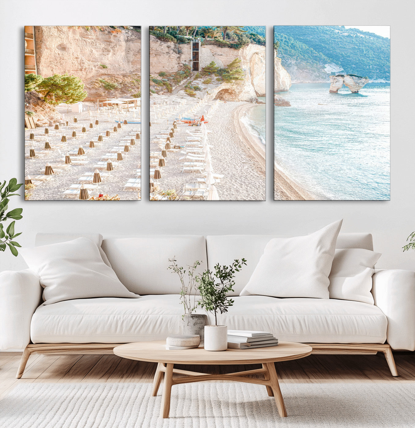 Wall art of a calm Mediterranean beach with rows of sun loungers and umbrellas in soft pastel tones, perfect for light coastal or vacation-themed decor.