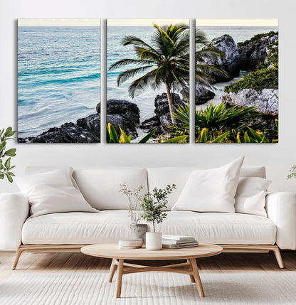 Framed canvas of a vibrant tropical coastline with palm trees, rocky cliffs, and turquoise waters, ideal for tropical coastal home decor.