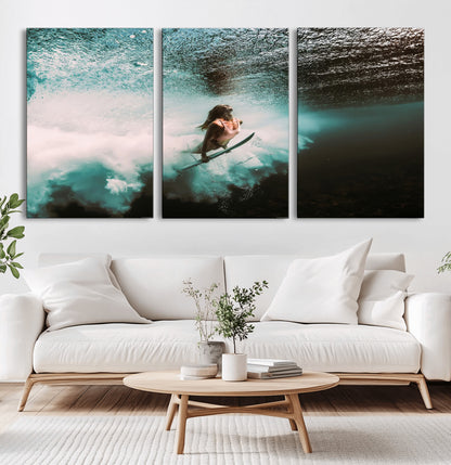 Vibrant underwater photo of a female surfer diving through turquoise waves, perfect for coastal boho or surf-inspired home decor.