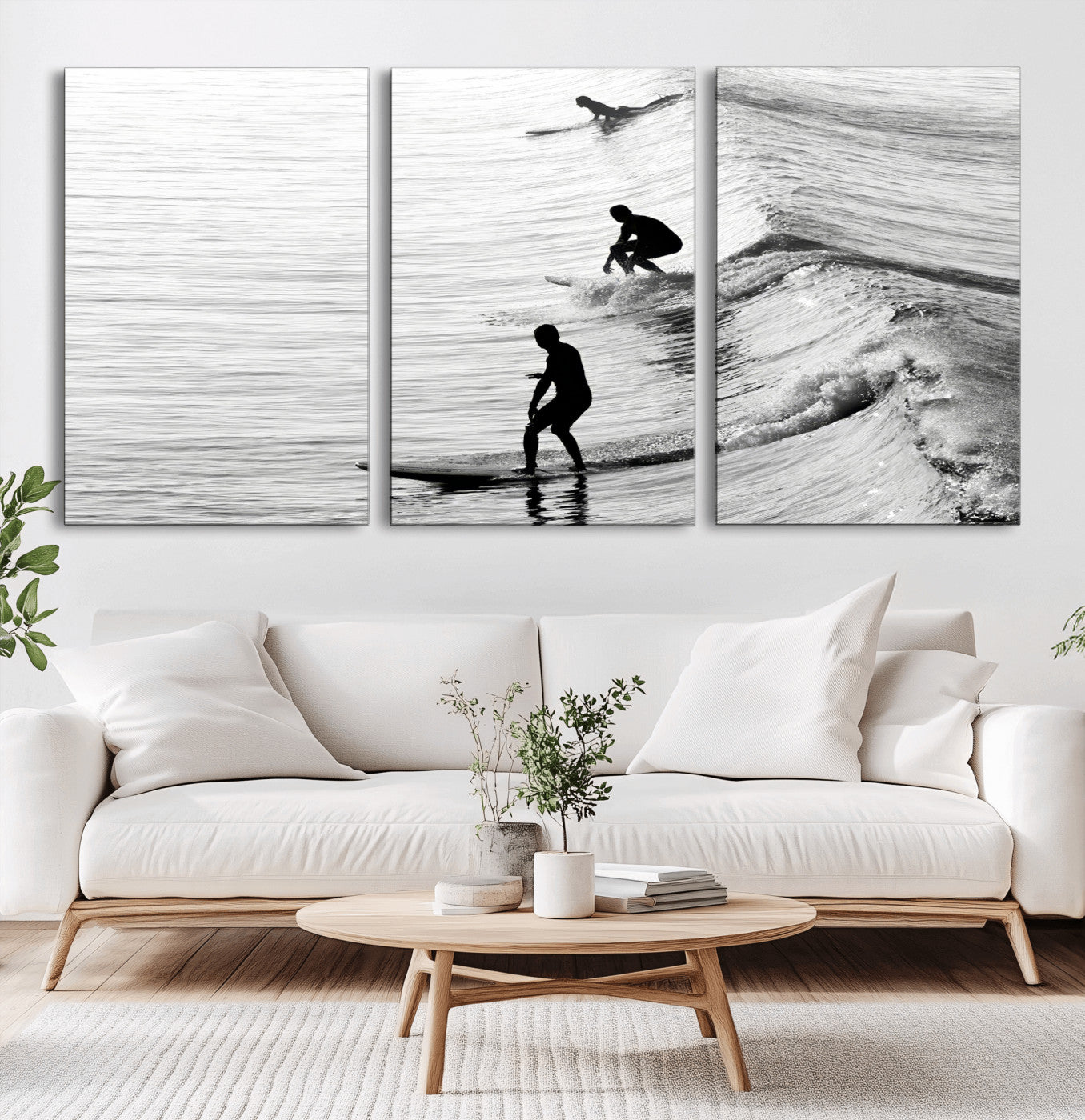 Black and white photo of surfers riding waves in a moody, high-contrast scene, ideal for modern coastal or surf-inspired home decor.