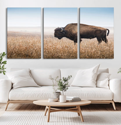 A majestic bison standing in an open prairie field, its strong form blending into the golden grass under a vast blue sky, evoking the wild spirit of the American plains.