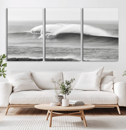 A dramatic black and white ocean wave crashing with immense force, capturing the raw power and movement of the sea in a bold seascape.