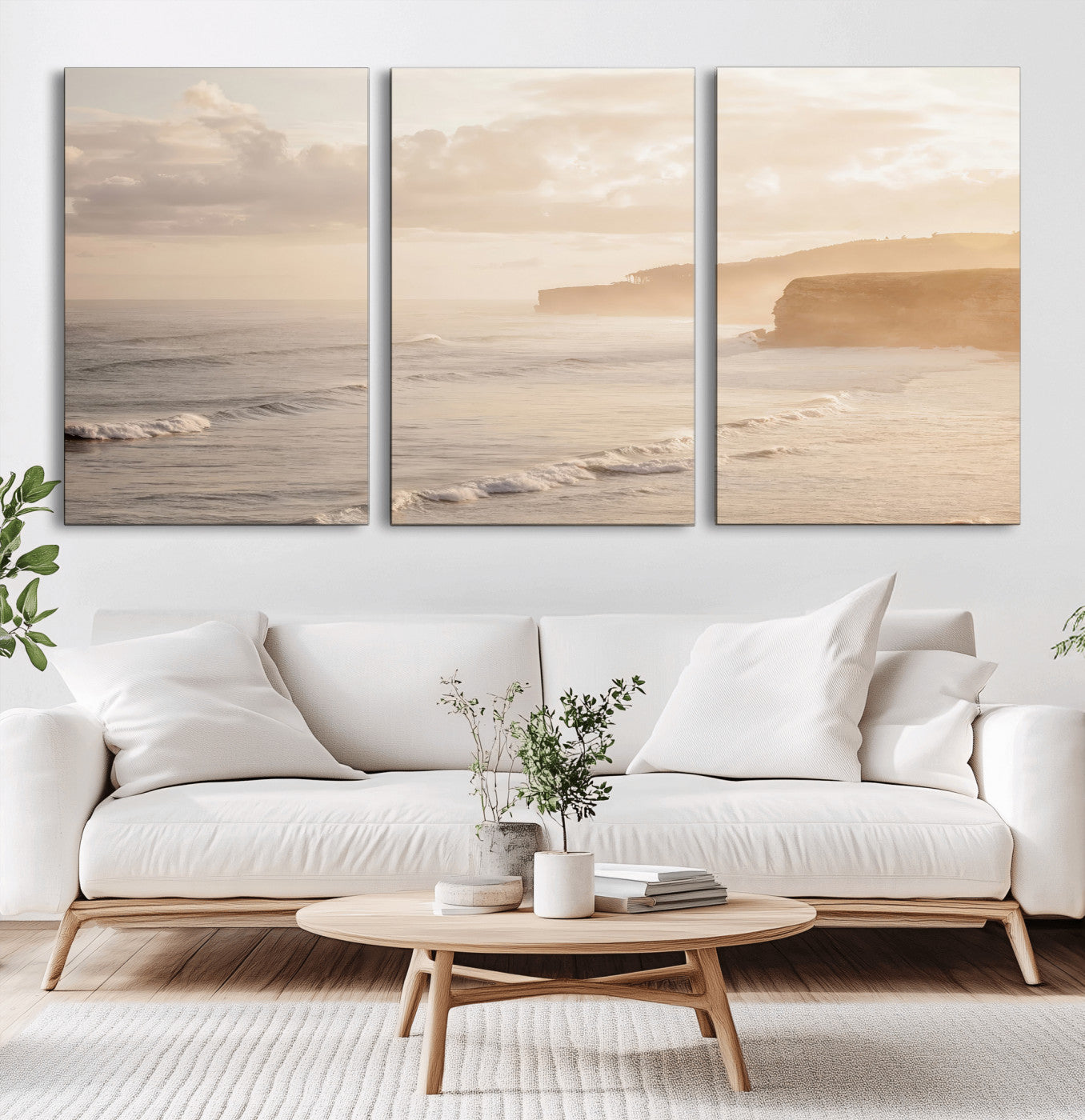 Golden hour seascape with misty cliffs and gentle waves rolling towards the shore, capturing a tranquil and warm coastal atmosphere.