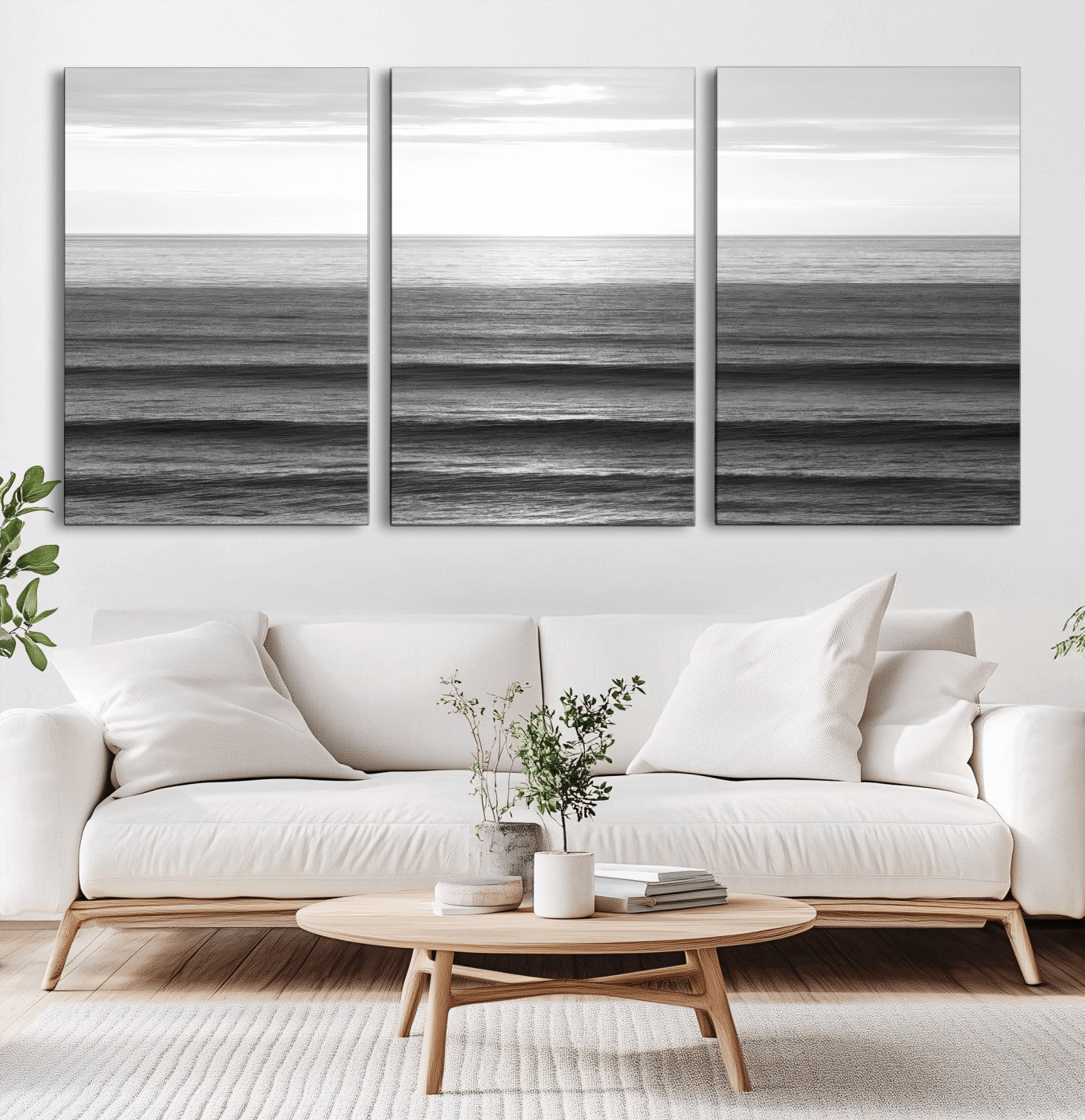 Minimalist black and white ocean view with layered waves reflecting sunlight, evoking a sense of calm and coastal serenity.