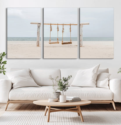 A rustic wooden beach swing stands on a serene sandy shore with an ocean horizon in the background, creating a tranquil and dreamy coastal escape.