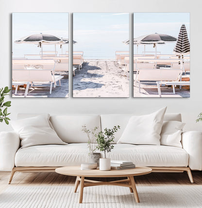 A serene minimalist beach scene featuring striped umbrellas, soft pastel sand, and an elegant lounge setup, creating a tranquil and stylish coastal retreat.
