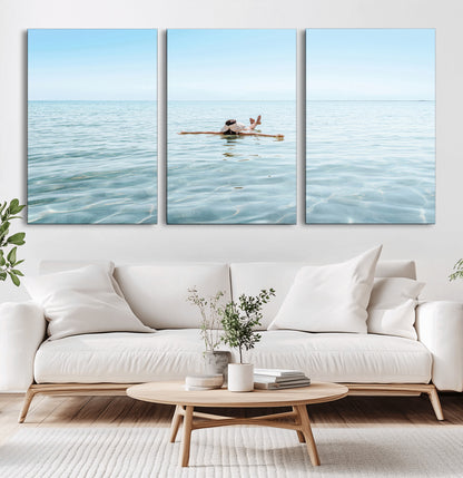 A peaceful minimalist scene of a person floating on crystal-clear water, surrounded by a vast open horizon, capturing relaxation and serenity in a tranquil aquatic setting.