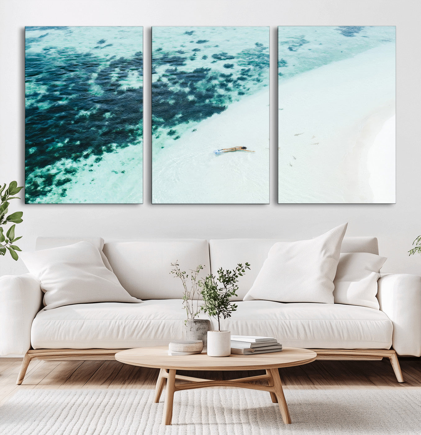 Canvas featuring an aerial view of a swimmer in shallow turquoise waters with coral patterns, ideal for tropical coastal home decor.