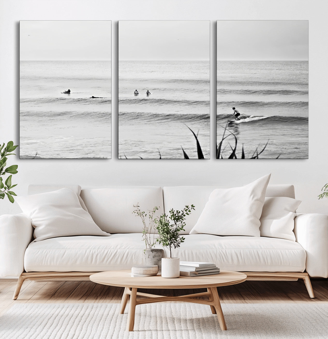 Monochrome canvas of surfers on calm ocean waves, ideal for minimalist coastal or beach-inspired interior decor.