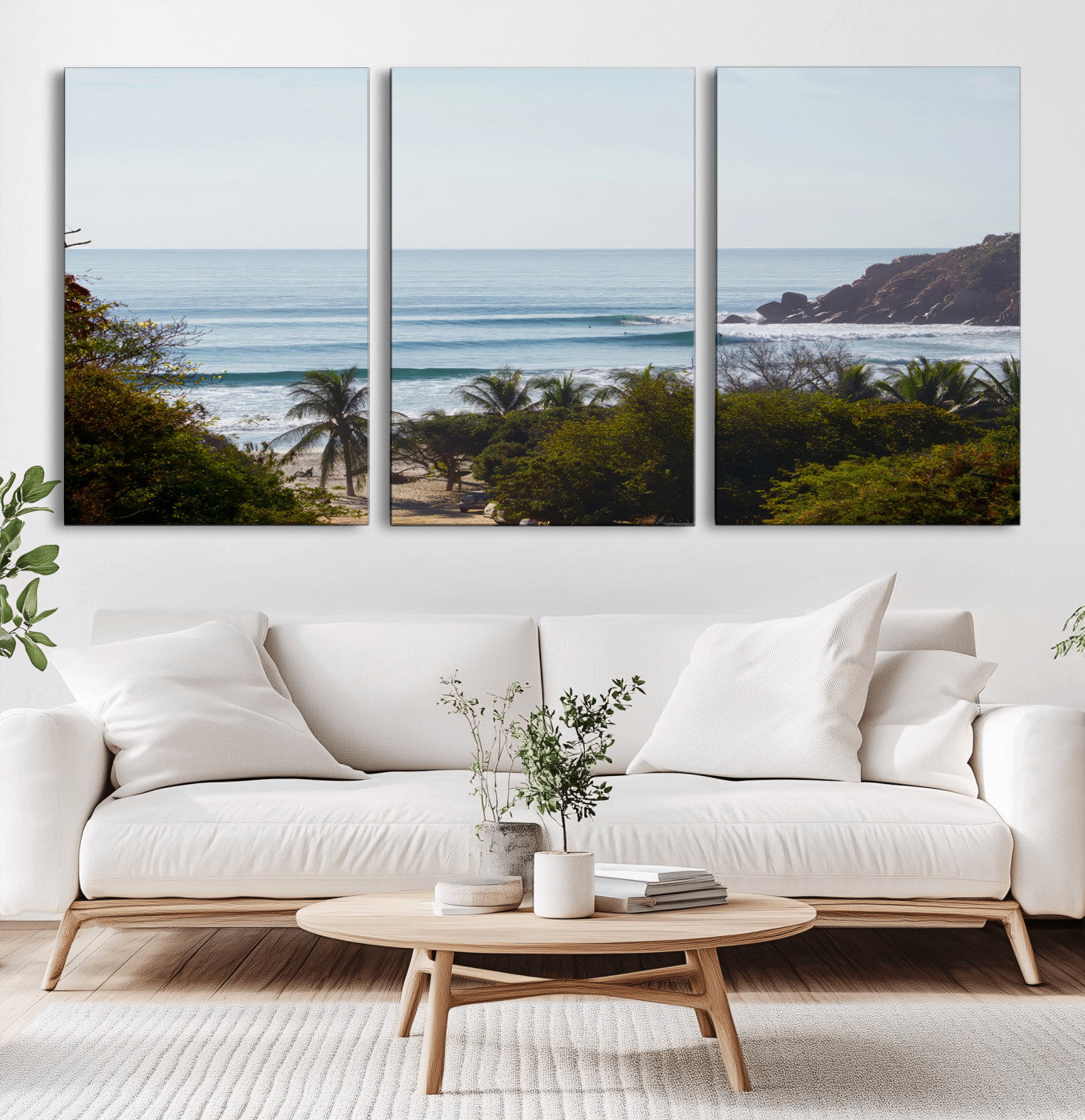 View of calm ocean waves with palm trees and a tropical coastline, ideal for coastal boho or beach-themed wall decor.