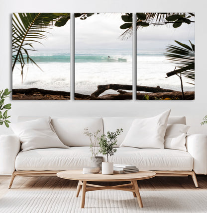 Tropical beach view with palm trees and surfer riding a wave, perfect for boho or coastal-inspired interior wall decor.