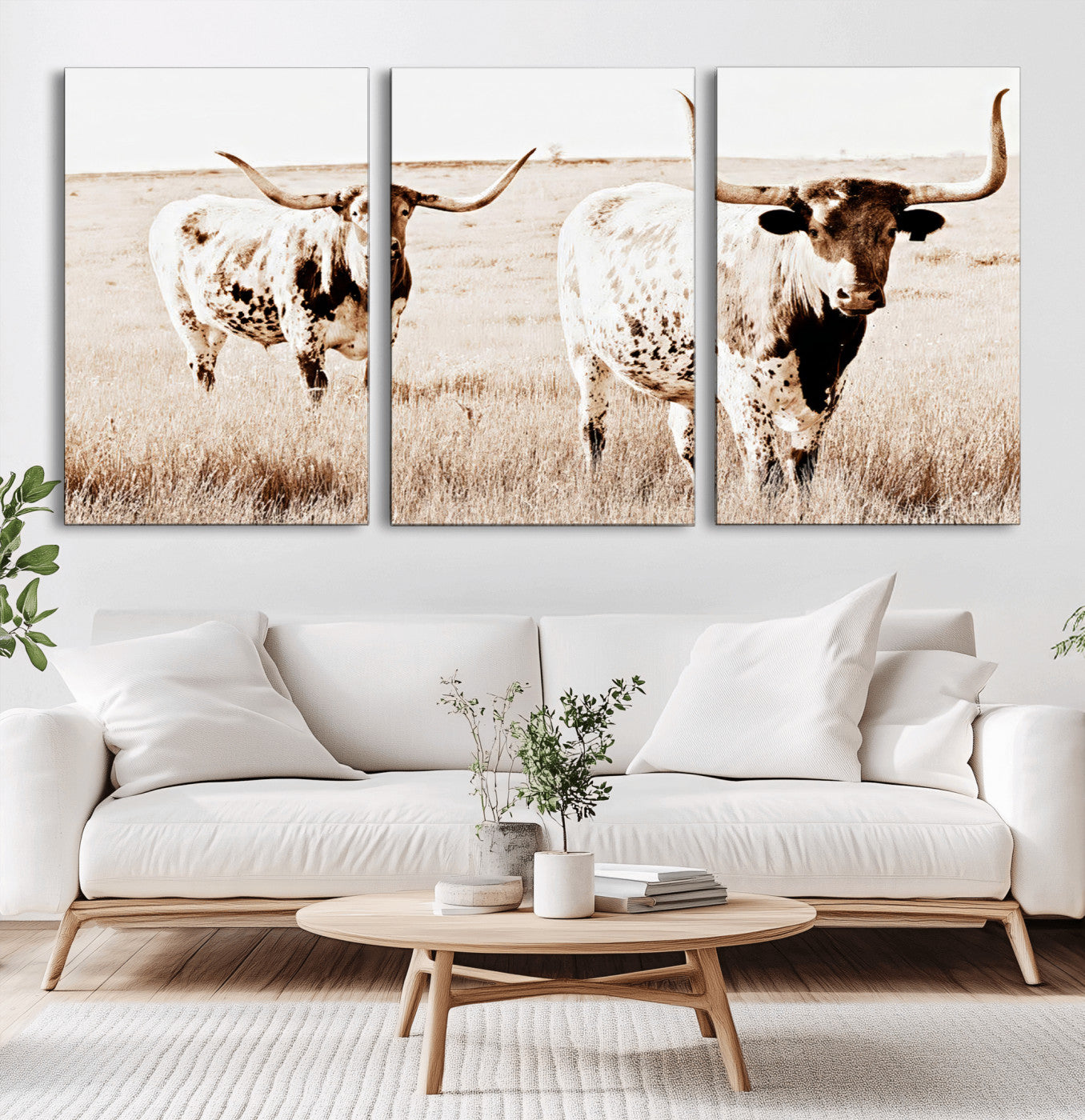 Two Texas longhorn cows standing in a sepia-toned pasture, evoking rustic charm perfect for farmhouse or western country interiors. (
