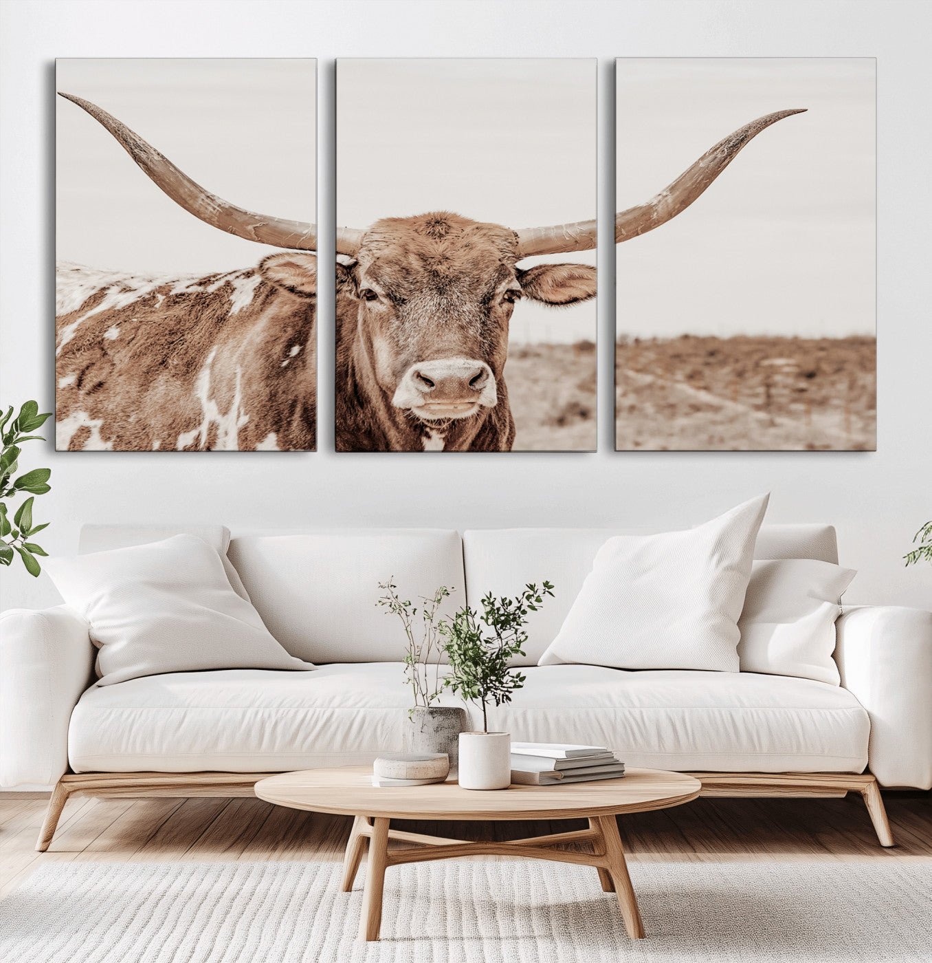 A longhorn cow in soft beige desert tones, standing calmly in open land, perfect for neutral western or rustic farmhouse interiors.
