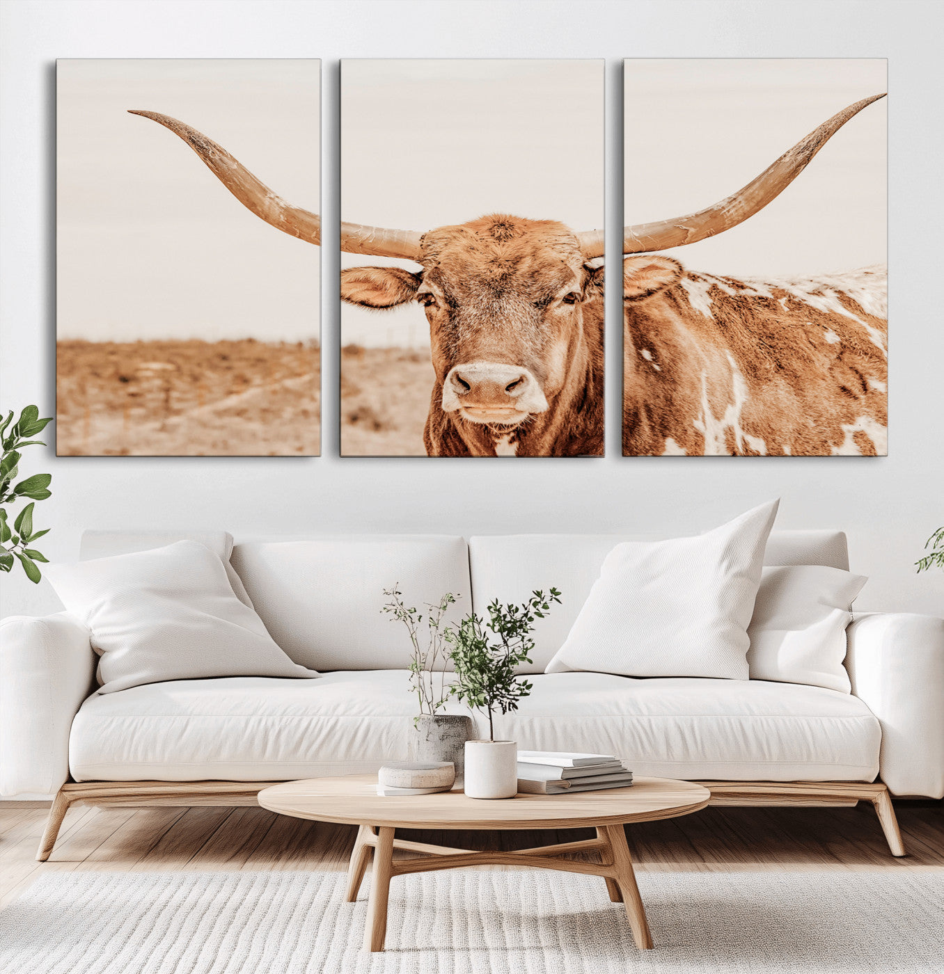 A longhorn bull standing proudly in a sunlit desert field with warm neutral tones, ideal for rustic western or farmhouse interiors.