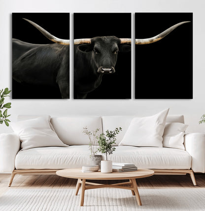 Close-up of a black Texas longhorn with large curved horns on black background, ideal for rustic farmhouse or modern western interiors.