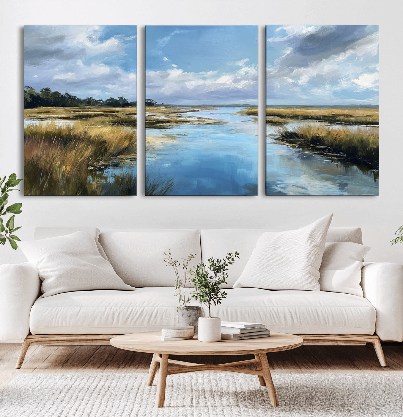 A beautiful, painterly landscape of a calm river winding through a marsh, with vibrant green grasses and a bright blue sky filled with fluffy clouds.
