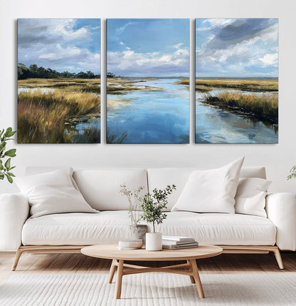 A beautiful, painterly landscape of a calm river winding through a marsh, with vibrant green grasses and a bright blue sky filled with fluffy clouds.