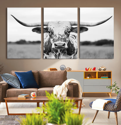 Capture the strength and elegance of nature with this striking black and white portrait of a longhorn cow. Its powerful presence makes a bold statement in any room.
