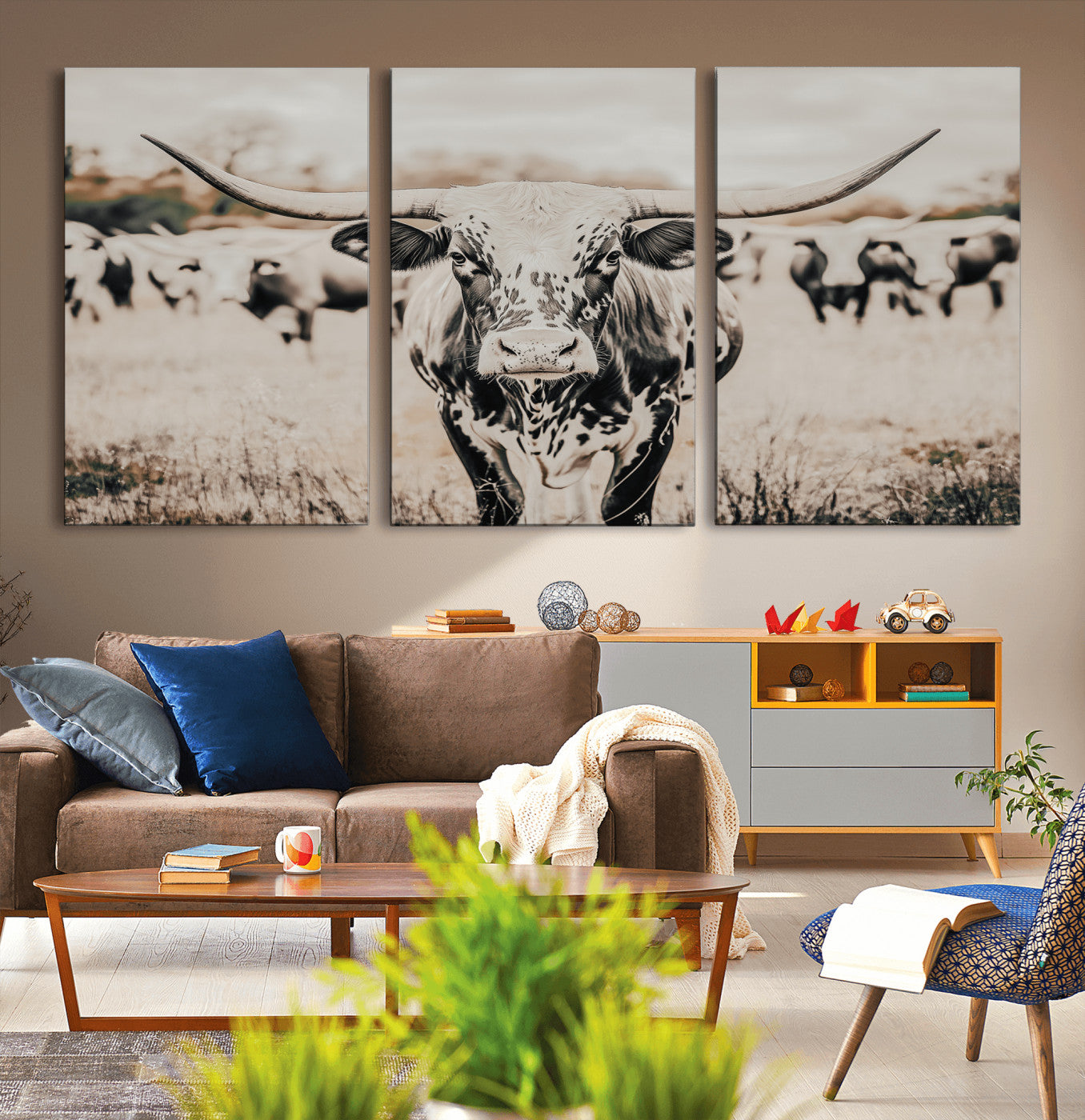 Canvas of a speckled Texas longhorn standing boldly in a field with a herd behind, perfect for rustic western or farmhouse wall decor.