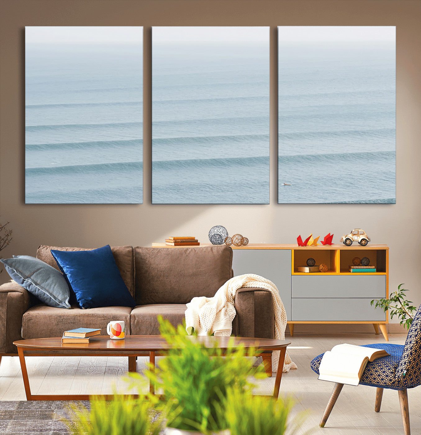 Framed canvas of repeating ocean waves with a distant solo surfer, ideal for minimalist ocean or calm coastal wall decor.