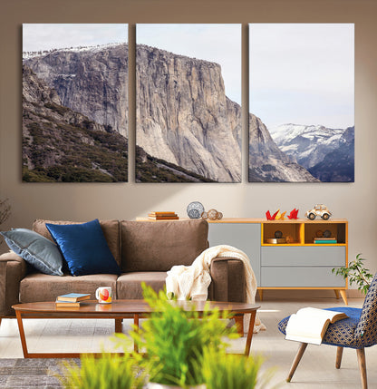 Framed canvas of El Capitan’s vertical granite face in Yosemite with snowy peaks, ideal for Sierra minimalism or mountain-inspired decor.