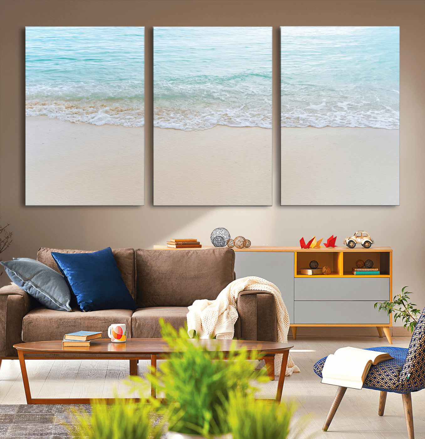 Soft shoreline with gentle aqua waves on smooth sand, ideal for minimalist coastal or pastel ocean-inspired home wall decor.