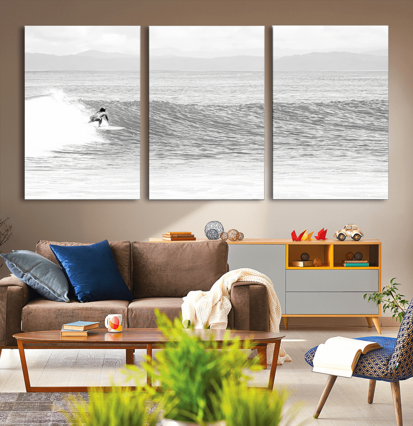 Monochrome photo of a surfer riding a wave with distant mountains, ideal for coastal motion or black and white surf-themed wall decor.