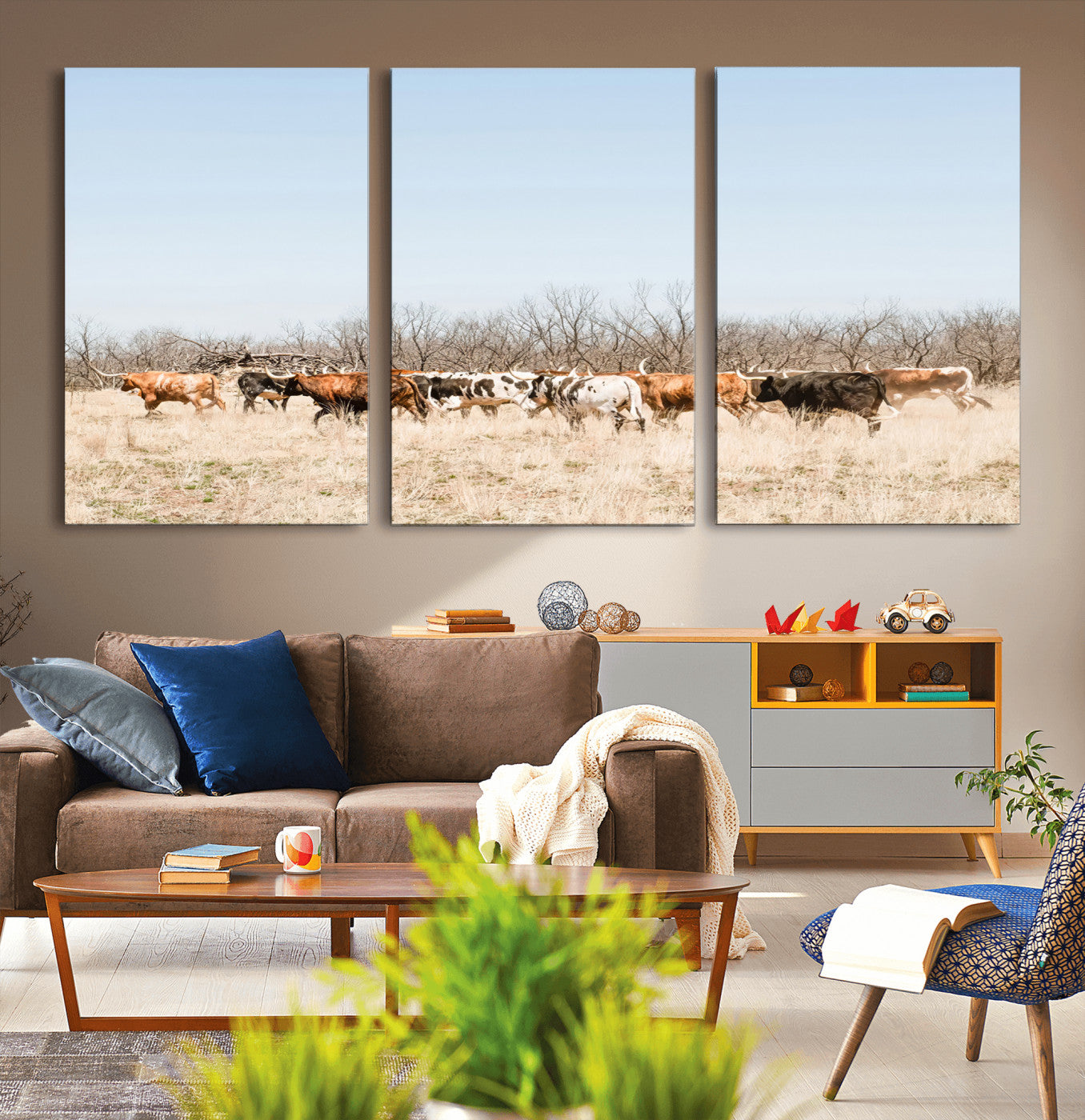 Framed wall art of Texas longhorn cattle walking through a dry, neutral-toned prairie, perfect for rustic farmhouse or western-themed home decor.