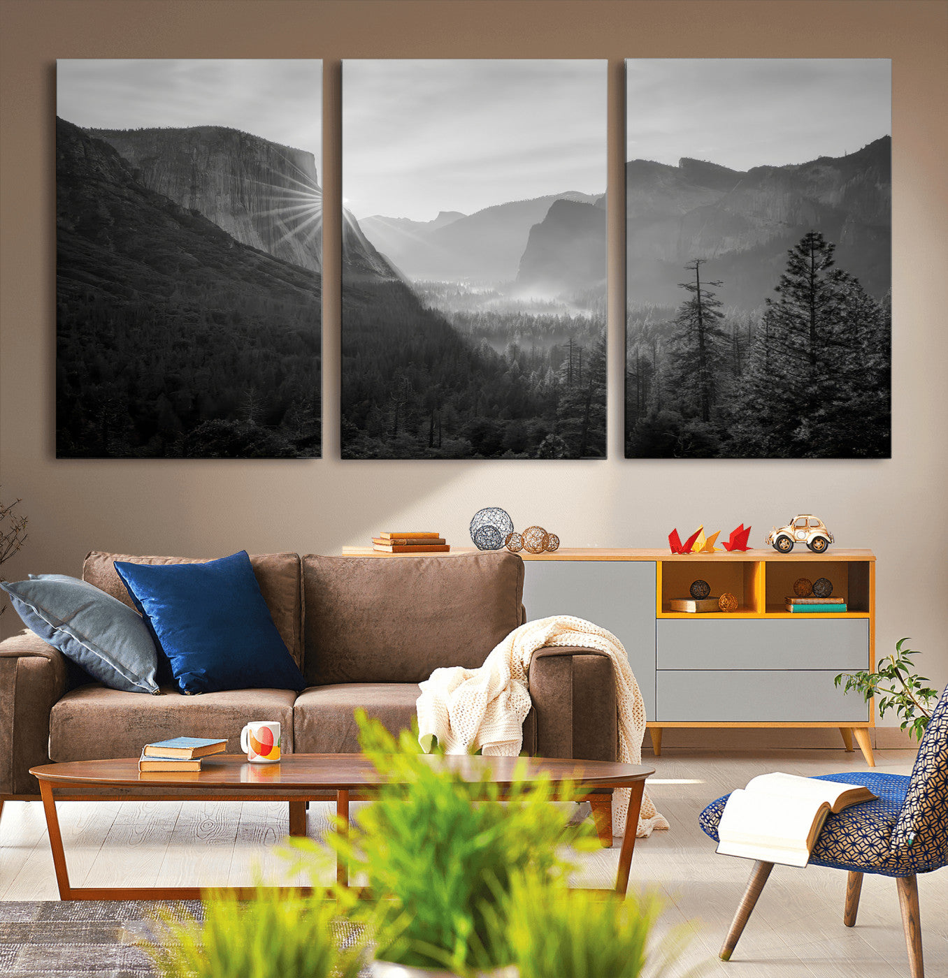 Black and white landscape of Yosemite with sun rays peeking over El Capitan, ideal for moody nature or modern rustic decor.