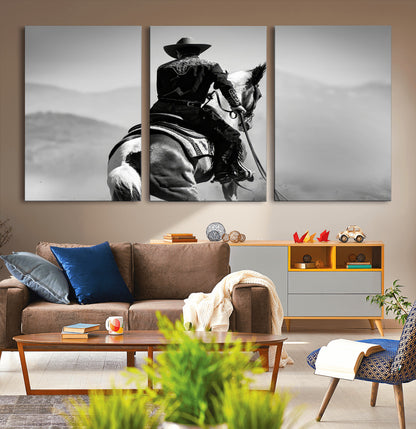 Black and white canvas of a cowboy on horseback with moody tones, perfect for rustic western or country-inspired home decor.