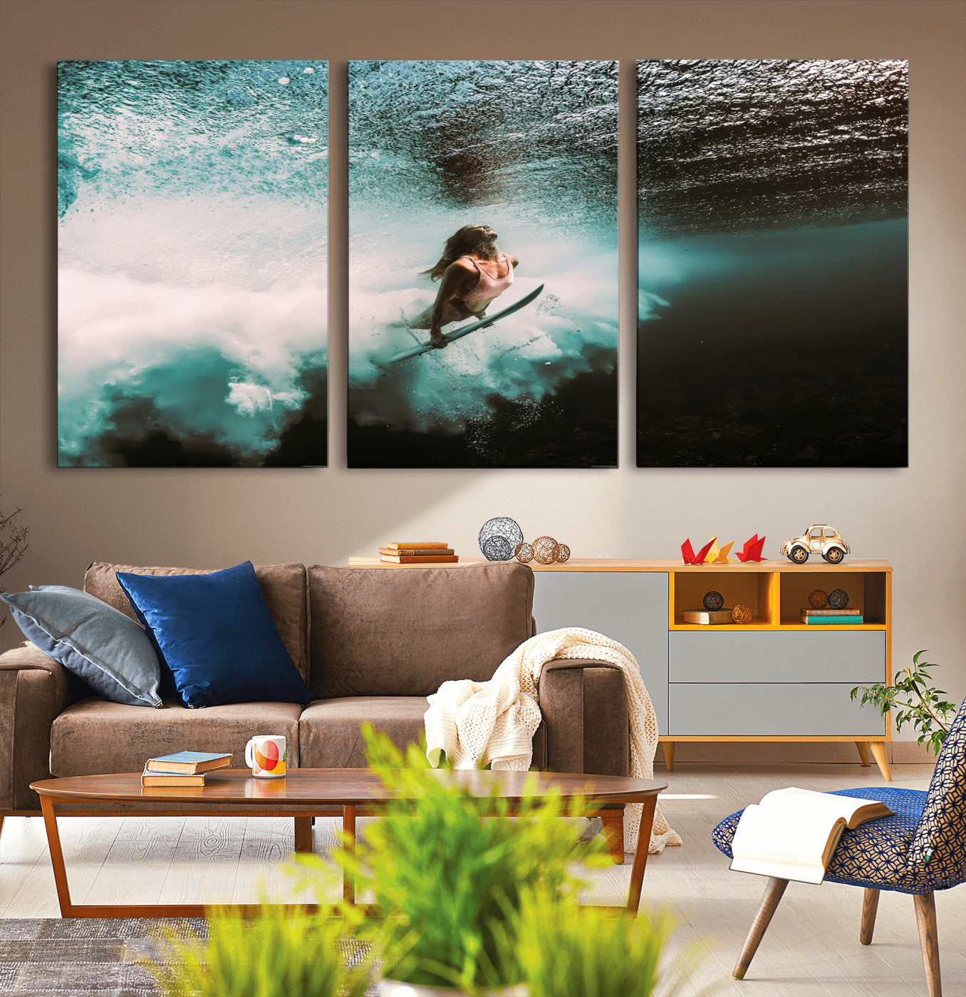 Vibrant underwater photo of a female surfer diving through turquoise waves, perfect for coastal boho or surf-inspired home decor.
