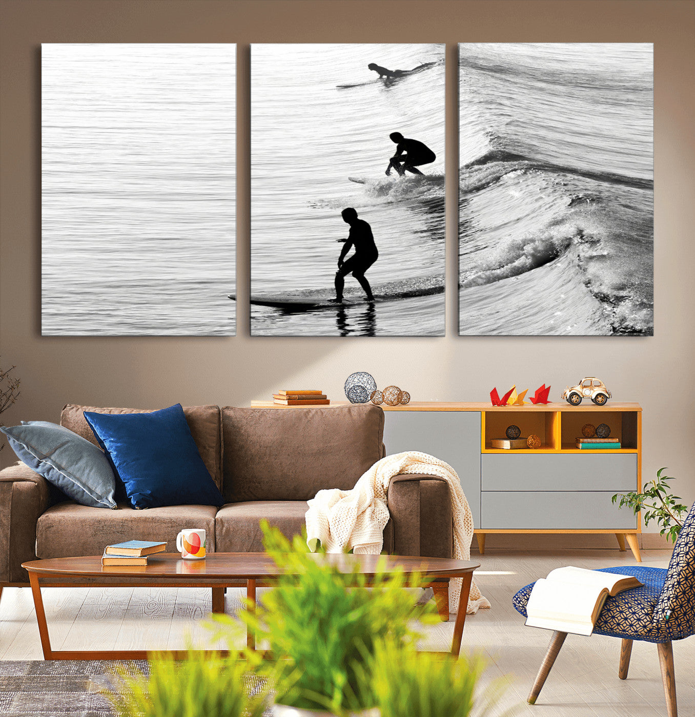 Black and white photo of surfers riding waves in a moody, high-contrast scene, ideal for modern coastal or surf-inspired home decor.