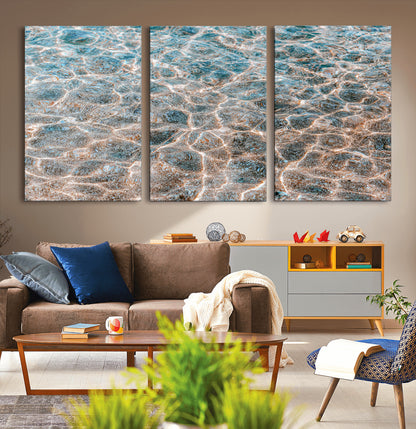 Close-up of sunlit ocean ripples with aqua blue and golden tones, ideal for modern coastal or minimalist home decor.