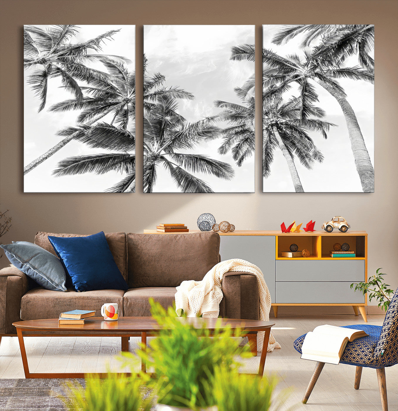 Black and white tropical palm trees viewed from below, swaying gently against a bright sky, creating a serene and elegant coastal atmosphere.