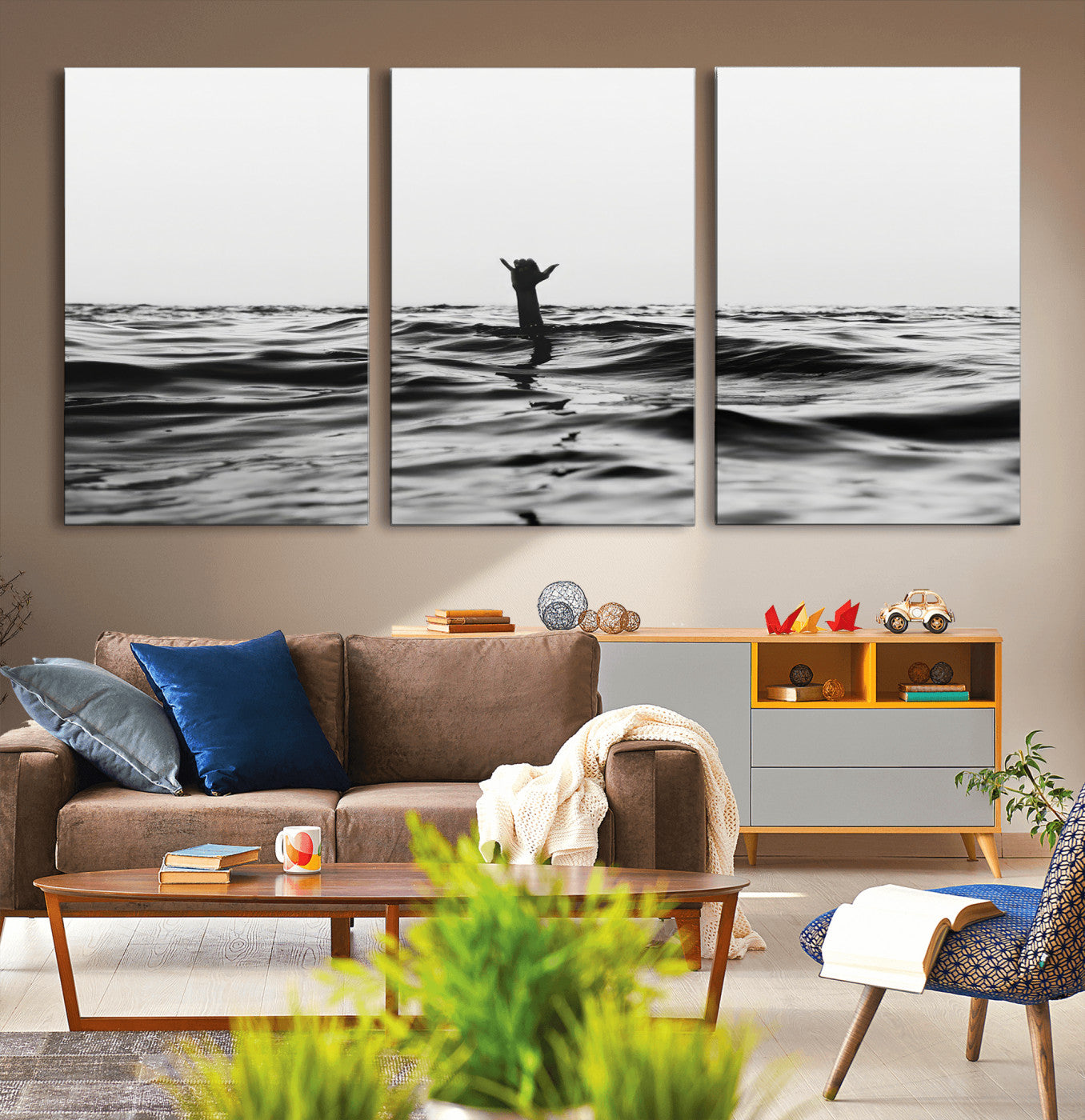 Black and white ocean with a hand making a surfer sign among dark waves, creating a dramatic and minimalist seascape with bold contrast.