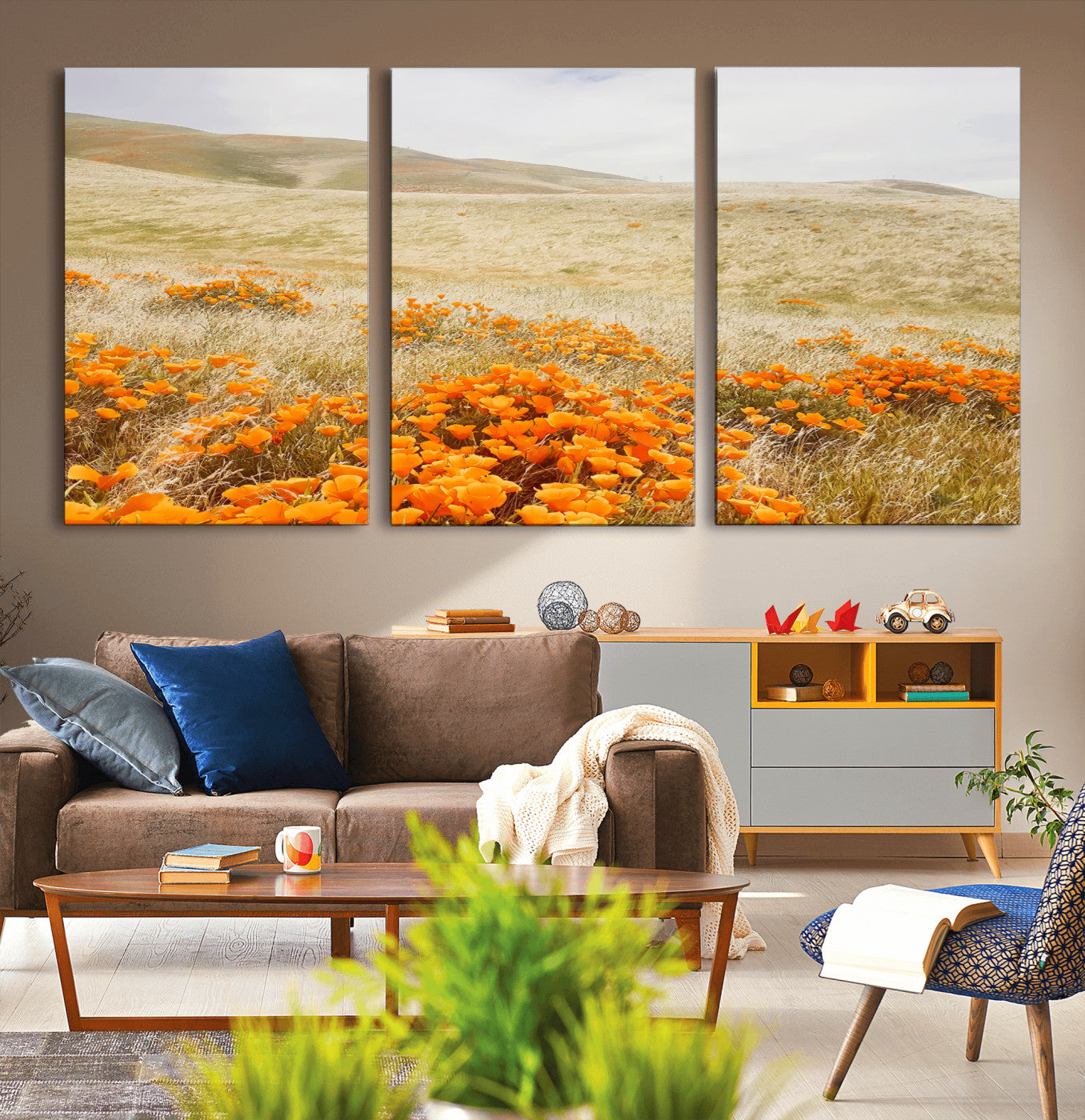A golden field with vibrant orange poppies blooming across rolling hills under a soft, sunlit sky, creating a warm and rustic landscape.