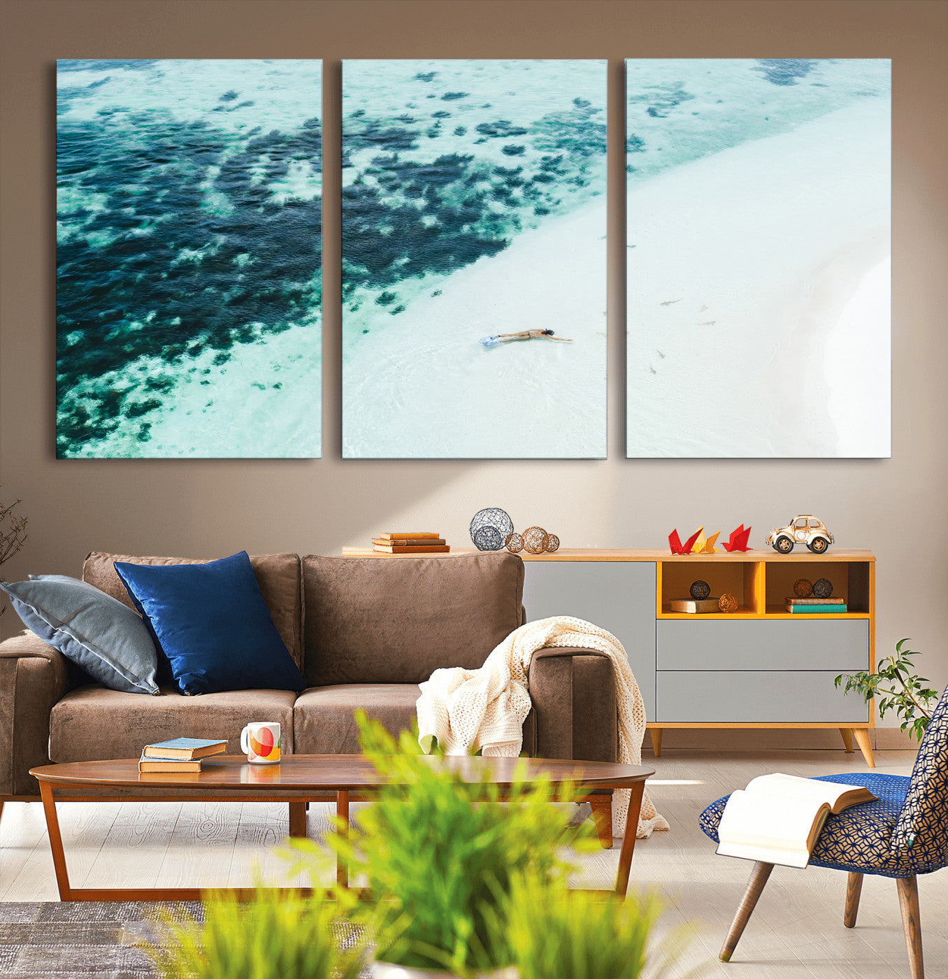 Canvas featuring an aerial view of a swimmer in shallow turquoise waters with coral patterns, ideal for tropical coastal home decor.