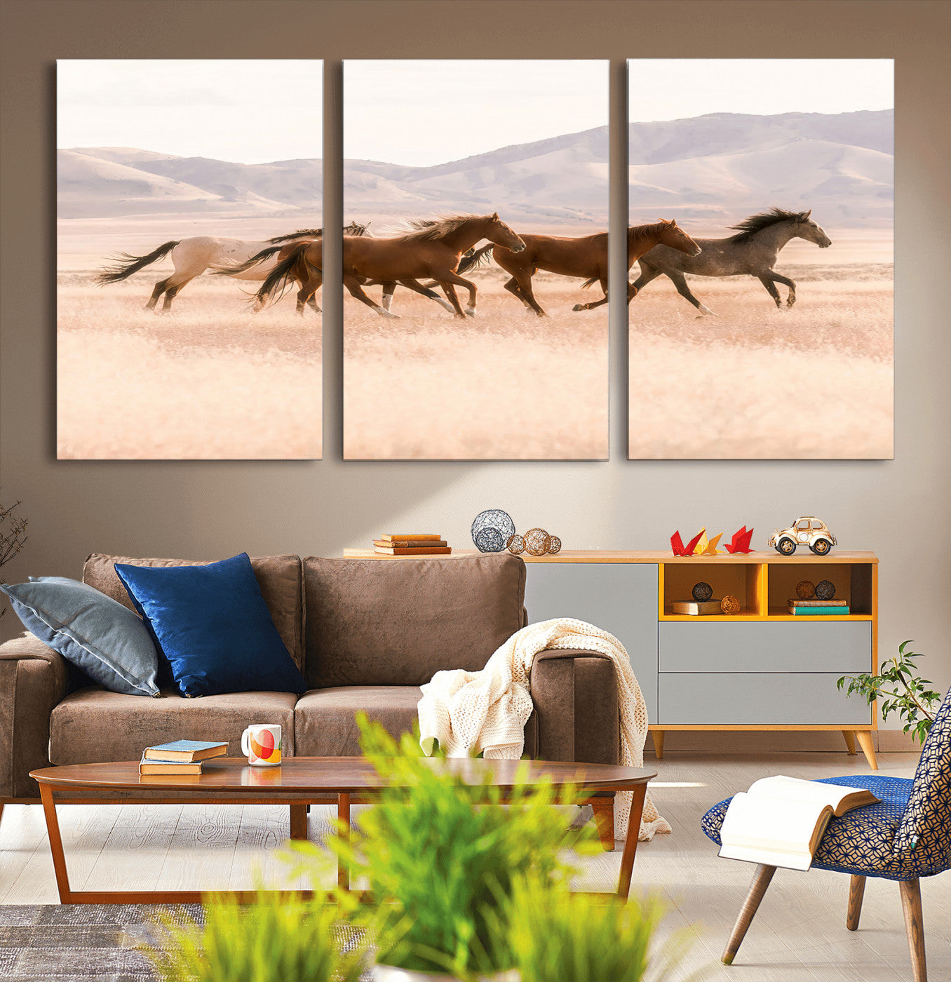 A herd of wild horses galloping through a sunlit desert plain with mountains in the background, perfect for rustic or western-themed wall decor.