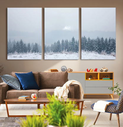 Snow-covered forest under misty sky, soft light breaking through clouds, ideal for minimalist or Nordic-inspired home decor.
