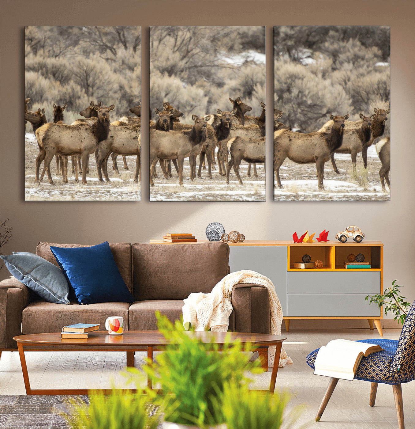 A large herd of elk standing in an open field with soft earthy tones, ideal for rustic lodge or western-themed home wall decor.