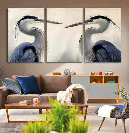 Two blue herons facing each other on a soft neutral background, ideal for coastal, tranquil, or nature-inspired minimalist interiors.