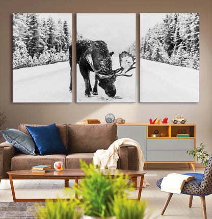 A majestic moose grazing in the snow-covered wilderness, surrounded by snow-covered trees, creating a peaceful winter scene.