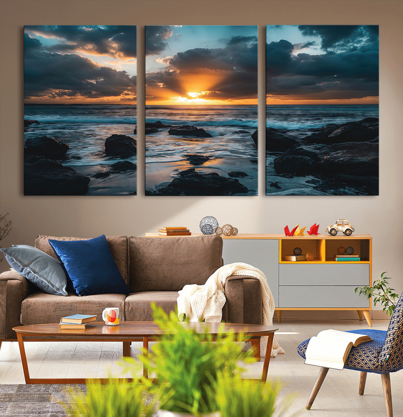 An awe-inspiring sunset over the ocean with rays of light piercing through dramatic clouds, creating a beautiful seascape with rocks in the foreground.