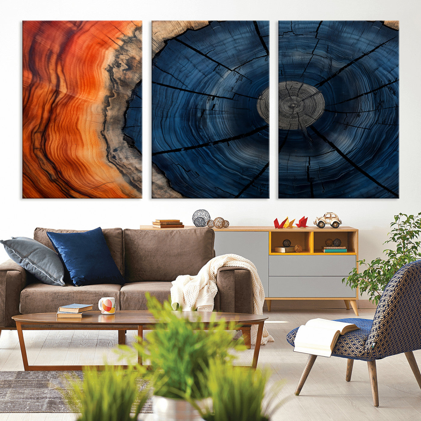 A captivating close-up of a tree trunk, showcasing its concentric rings in rich shades of blue, orange, and brown, highlighting the organic patterns of natural wood.
