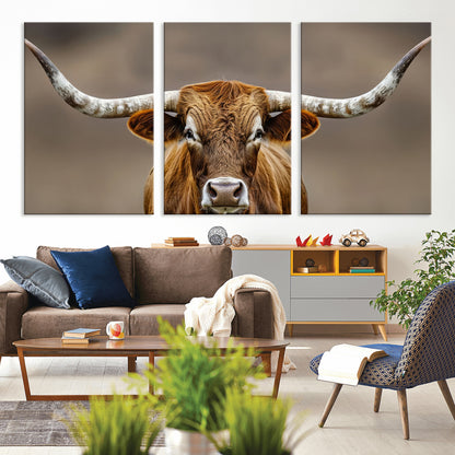 Close-up of a Texas Longhorn with strong curved horns and warm brown tones, perfect for rustic or western-style wall decor.