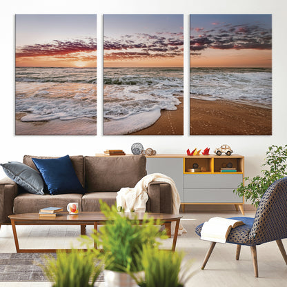 Canvas of a sunset over a foamy ocean shore with warm light and gentle waves, ideal for coastal or beach-themed home decor.