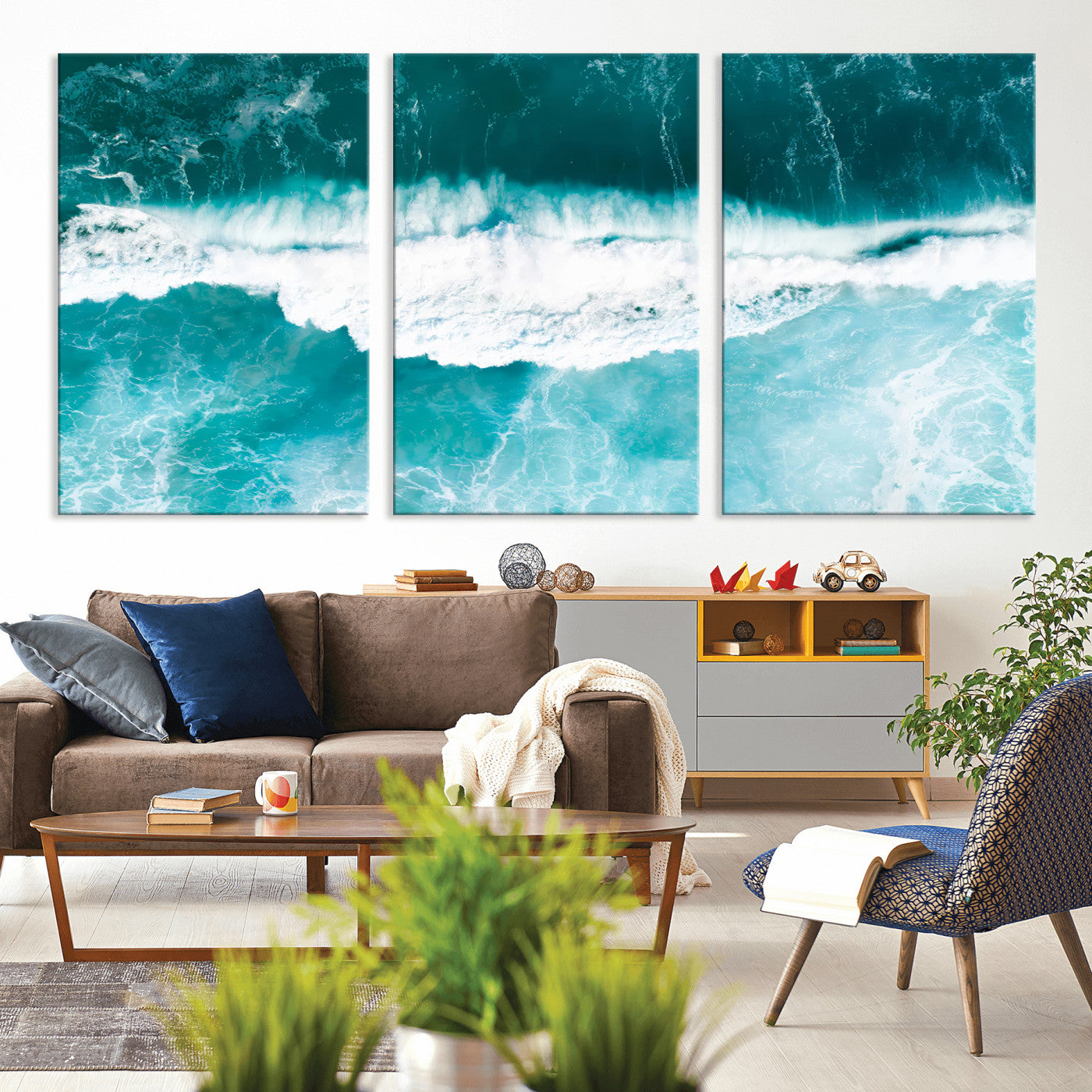 Aerial view of turquoise ocean waves crashing with white foam, perfect for tropical coastal or modern beach-style home decor.