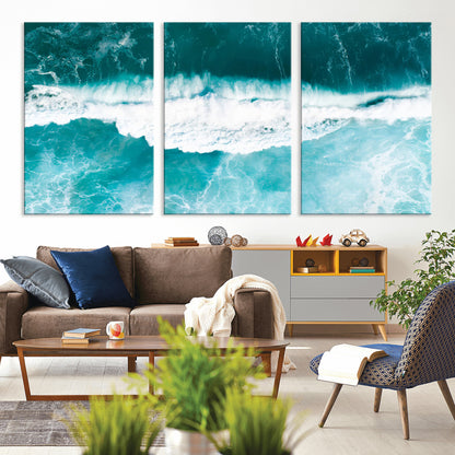 Aerial view of turquoise ocean waves crashing with white foam, perfect for tropical coastal or modern beach-style home decor.