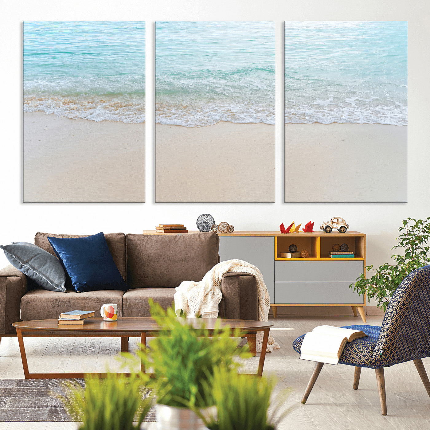 Soft shoreline with gentle aqua waves on smooth sand, ideal for minimalist coastal or pastel ocean-inspired home wall decor.